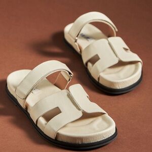 Bibi Lou cutout slide sandals in cream